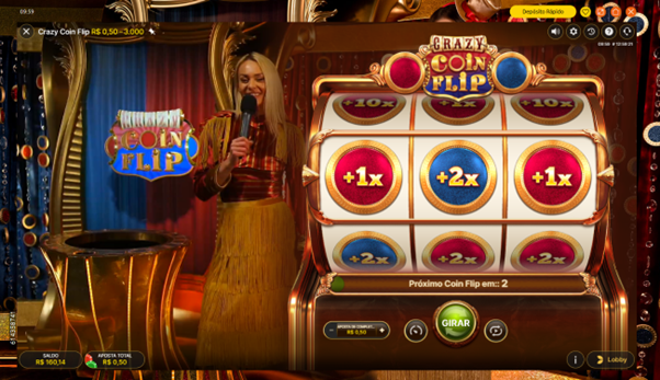 Tela do jogo Crazy Coin Flip na fase Top-Up, mostrando dealer real e o cilindro 3x3. Na parte inferior da grade, h&aacute; a mensagem &ldquo;Pr&oacute;ximo Coin Flip em:: 2&rdquo; indicando o tempo restante para giros. 