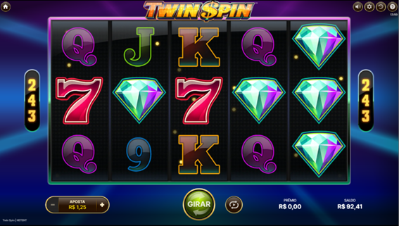 Tela do jogo base de Twin Spin slot, exibindo a grade com s&iacute;mbolos de joias, letras e n&uacute;meros.