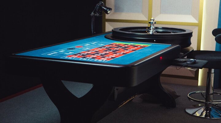 Croupier indicates no more bets at Evolution Gaming live roulette casino table